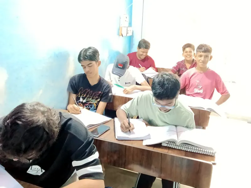 A batch of students at work in the classroom